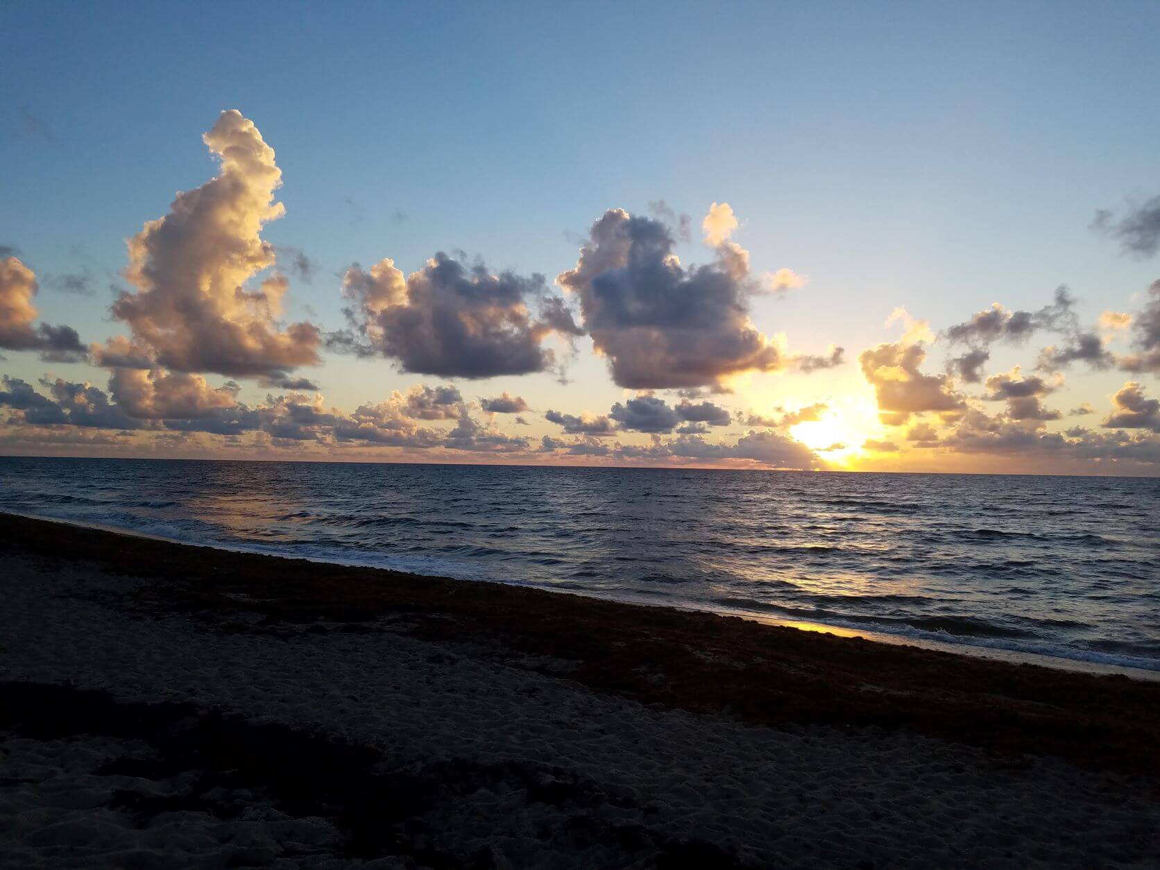 alt text = "delray beach florida sunrise on the atlantic shoreline"