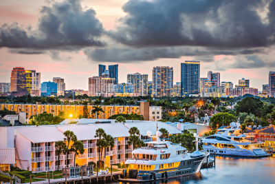 alt text = "canal front condos with the fort lauderdale florida skyline in the backdrop"