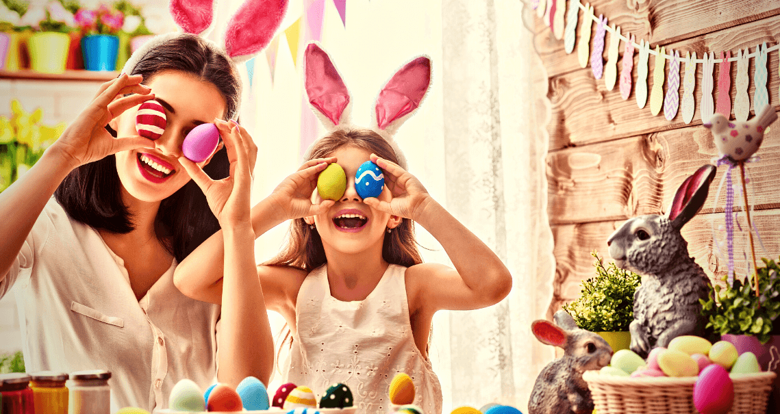 alt text = "mother and daughter getting silly with easter decorations in south florida"