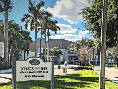 alt = "kings point golf and country club main clubhouse entrance in delray beach south florida"