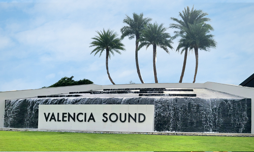 alt="Valencia Sound community sign mounted to a large water fountain"