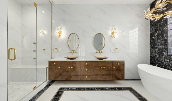 Luxury modern bathroom with soaking tub, Roman shower, double sinks, heated floors, and premium marble finishes