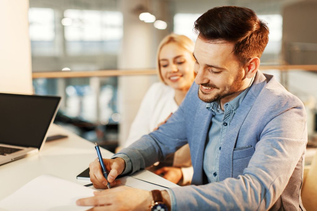 Getting pre-approved for mortgage with homebuyer reviewing financial documents